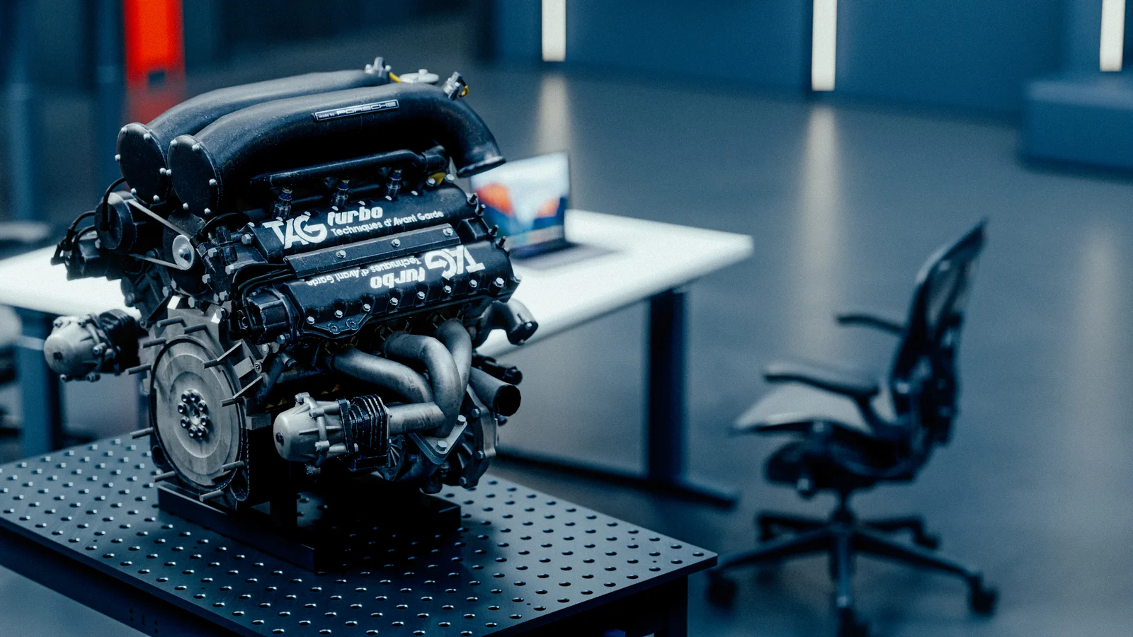 TAG Turbo Porsche engine in a workshop, rendered in 3D.